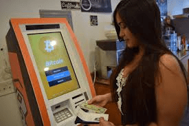 Woman Using A Bitcoin ATM